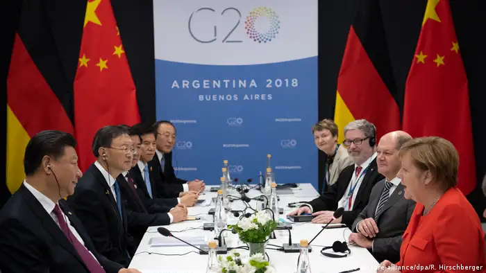 图为2018年12月在阿根廷布宜诺斯艾利斯的G20峰会，德国总理默克尔、时任财长肖尔茨等德国代表与中国国家主席习近平等举行了会谈