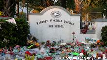 Flowers, candles and mementos sit outside one of the makeshift memorials at Marjory Stoneman Douglas High School in Parkland, Florida on February 27, 2018.
Florida's Marjory Stoneman Douglas high school will reopen on February 28, 2018 two weeks after 17 people were killed in a shooting by former student, Nikolas Cruz, leaving 17 people dead and 15 injured on February 14, 2018. / AFP PHOTO / RHONA WISE (Photo credit should read RHONA WISE/AFP/Getty Images)