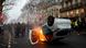 An overturned car burns during a demonstration by the "yellow vests" movement at Boulevard Saint Germain in Paris An overturned car burns during a demonstration by the "yellow vests" movement at Boulevard Saint Germain in Paris