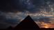 A silhouette of the pyramids of Giza A silhouette of the pyramids of Giza