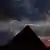 A silhouette of the pyramids of Giza