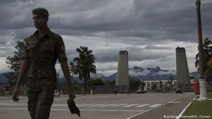 A Brazilian soldier walks by