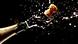 A cork bursts out of a champagne bottle A cork bursts out of a champagne bottle