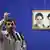 Iranian President Mahmoud Ahmadinejad speaks with photos of Ayatollah Khomeini and Ayatollah Ali Khamenei