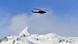 A helicopter flying over the Alps A helicopter flying over the Alps
