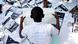A member of Congo's National Election Commission sits counting the votes A member of Congo's National Election Commission sits counting the votes