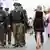 several German policemen and Oktoberfest visitors, walking