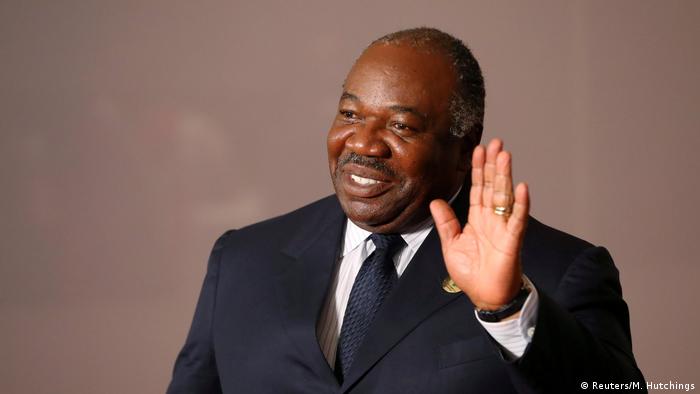 Gabon's President Ali Bongo waves his hand in greeting