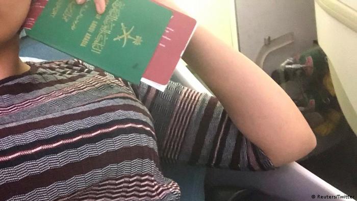 Rahaf Mohammed al-Qunun on a plane holding a passport