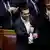 Tsipras gives the thumbs up after winning the confidence vote