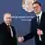 Zwei Männer in Anzug (Putin und Vucic) geben sich die Hand und lächeln