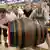 Four men push a giant keg of beer at the Oktoberfest