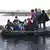 Ein Schlauchboot bringt honduranische Auswanderer über den Río Suchiate nach Mexiko