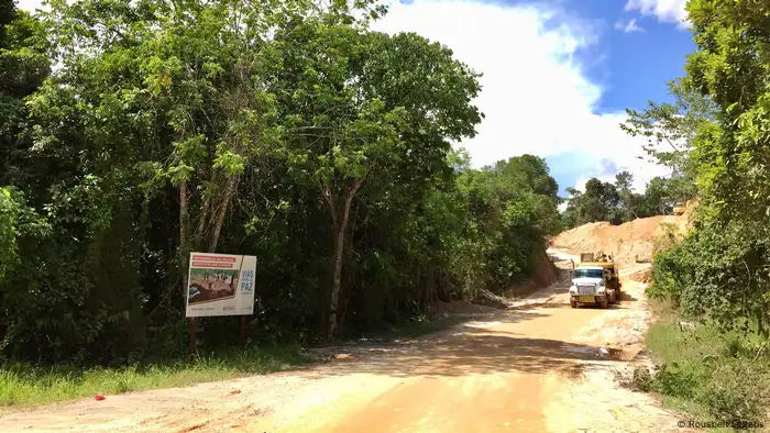 a truck drives on a not bituminized road