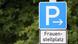 A blue sign reserving a parking place for women A blue sign reserving a parking place for women