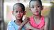 A photo from Aug, 2000, showing Katin Kethsamrau, left, and Angsana Suyata, standing together at the Human Development Foundation in Bangkok, Thailand. Both were infected with the AIDS virus at birth. A photo from Aug, 2000, showing Katin Kethsamrau, left, and Angsana Suyata, standing together at the Human Development Foundation in Bangkok, Thailand. Both were infected with the AIDS virus at birth.