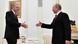 Erdogan and Putin go towards one another to shake hands in Moscow Erdogan and Putin go towards one another to shake hands in Moscow