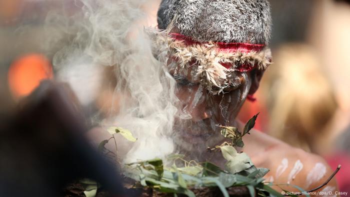 An indigenous man taking part in an Invasion Demo