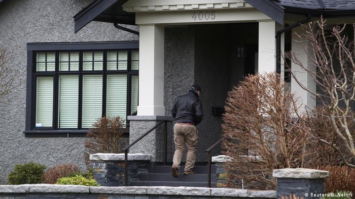 Meng Wanzhou's family mansion in Vancouver, with a security guard outside
