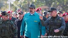 Venezuela's President Nicolas Maduro speaks with Venezuela's Defense Minister Vladimir Padrino Lopez and Remigio Ceballos Strategic Operational Commander of the Bolivarian National Armed Forces, during a military exercise in Valencia, Venezuela January 27, 2019. Miraflores Palace/Handout via REUTERS ATTENTION EDITORS - THIS PICTURE WAS PROVIDED BY A THIRD PARTY.