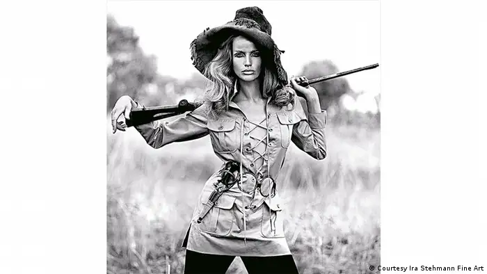 Veruschka von Lehndorff in a safari dress by Yves Saint Laurent, holding a rifle. Photo by Franco Rubartelli (Courtesy Ira Stehmann Fine Art)