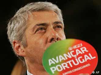 Premier Socrates uses a fan that reads advance Portugal during an election closing rally in Lisbon