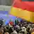 Supporters of the Christian Democratic Party, CDU, celebrate with Chancellor Angela Merkel, center, after the German general elections in Berlin, Sunday, Sept. 27, 2009. (AP Photo/Franka Bruns)