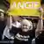 Supporter of Angela Merkel holding a poster which reads "Angie"