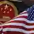 An American flag flies next to China's national emblem