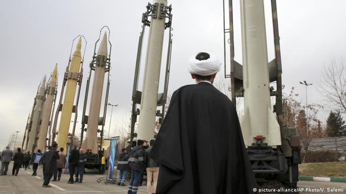 An Iranian cleric looks at domestically built surface to surface missiles at a military show marking the 40th anniversary of Iran's Islamic Revolution that toppled the U.S.-backed shah
