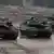 Two Bundeswehr Leopard 2A6 tanks and one Puma armoured infantry vehicle during a training excersise