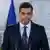 Pedro Sanchez looks befuddled while standing at a podium