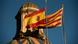 Spanish and Catalan flags atop Palau de la Generalitat building in Barcelona Spanish and Catalan flags atop Palau de la Generalitat building in Barcelona