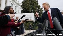 CNN journalist Abby Phillip asks President Donald Trump a question as he speaks with reporters before departing for France on the South Lawn of the White House, Friday, Nov. 9, 2018, in Washington. (AP Photo/Evan Vucci) |