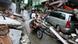 Residents ride a motorcycle in a neighborhood damaged by an earthquake in Padang, Indonesia Residents ride a motorcycle in a neighborhood damaged by an earthquake in Padang, Indonesia