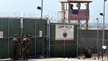 GUANTANAMO BAY, CUBA - APRIL 7: U.S. Army soldiers stand at the entrance to Camp Delta where detainees from the U.S. war in Afghanistan live April 7, 2004 in Guantanamo Bay, Cuba. On April 20, the U.S. Supreme Court is expected to consider whether the detainees can ask U.S. courts to review their cases. Approximately 600 prisoners from the U.S. war in Afghanistan remain in detention. (Photo by Joe Raedle/Getty Images)