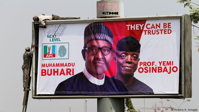 Workers fix an election campaign billboard depicting Nigerian President Muhammadu Buhari and his Vice President, Yemi Osinbajo, in Abuja, Nigeria Workers fix an election campaign billboard depicting Nigerian President Muhammadu Buhari and his Vice President, Yemi Osinbajo, in Abuja, Nigeria