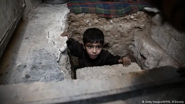 A child in a concrete shelter