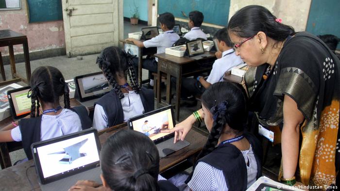 Primary School students in Mumbai in front of computer screens