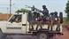 Armed Burkinabe gendarmes sit in the back of a pickup Armed Burkinabe gendarmes sit in the back of a pickup