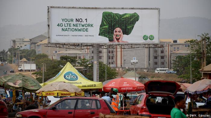 A giant ad for a Nigerian internet provider towers over the streets of Abuja