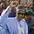 Nigeria's President Muhammadu Buhari gestures to supporters