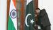 An Indian official adjusts the Pakistani flag prior to delegation levels talks at the Hyderabad House in New Delhi, India on 25 February 2010. An Indian official adjusts the Pakistani flag prior to delegation levels talks at the Hyderabad House in New Delhi, India on 25 February 2010.
