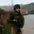 Израильский солдат на Западном берегу реки Иордан