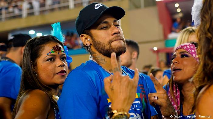 Brazilian football player Neymar attends the parade of the Vila Isabel samba school performance during the second night of Rio's Carnival parade
