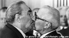 BER6 Berlin, East Germany, Oct. 4, 1979 - Soviet President Leonid Brezhnev and East German leader Erich Honecker change kisses after Brezhnev was honored with the title Hero of the German Democratic Republik and the Karl Marx Medal. Brezhnev participates in the celebrations marking the 30th anniversary of the East German State`s foundation. (AP Photo/Helmuth Lohmann/stf) |