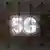 A 5G sign is seen inside the Xiaomi booth at the Mobile World Congress in Barcelona, Spain