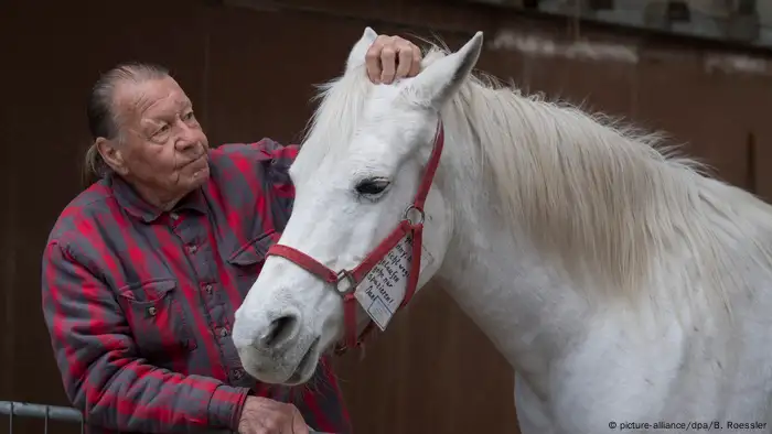 Werner Weischedel pets Jenny the Arabian mare