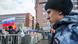 Russian serviceman watches crowd of protesters in Moscow Russian serviceman watches crowd of protesters in Moscow