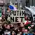 Protesters in Moscow holding sign saying "Putin net"
